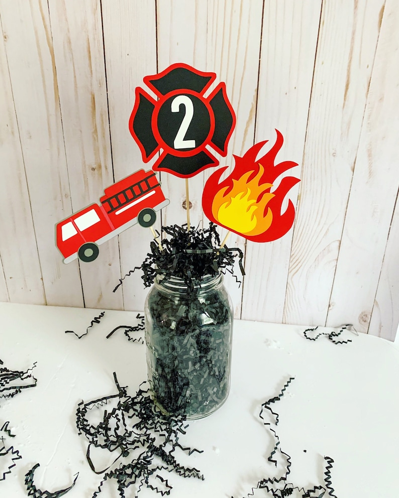 firefighter centerpiece birthday decorations featuring a firetruck, emblem with age, flame, fire hydrant, dalmatian and fire extinguisher