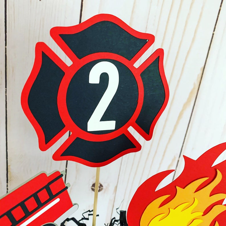 firefighter centerpiece birthday decorations featuring a firetruck, emblem with age, flame, fire hydrant, dalmatian and fire extinguisher