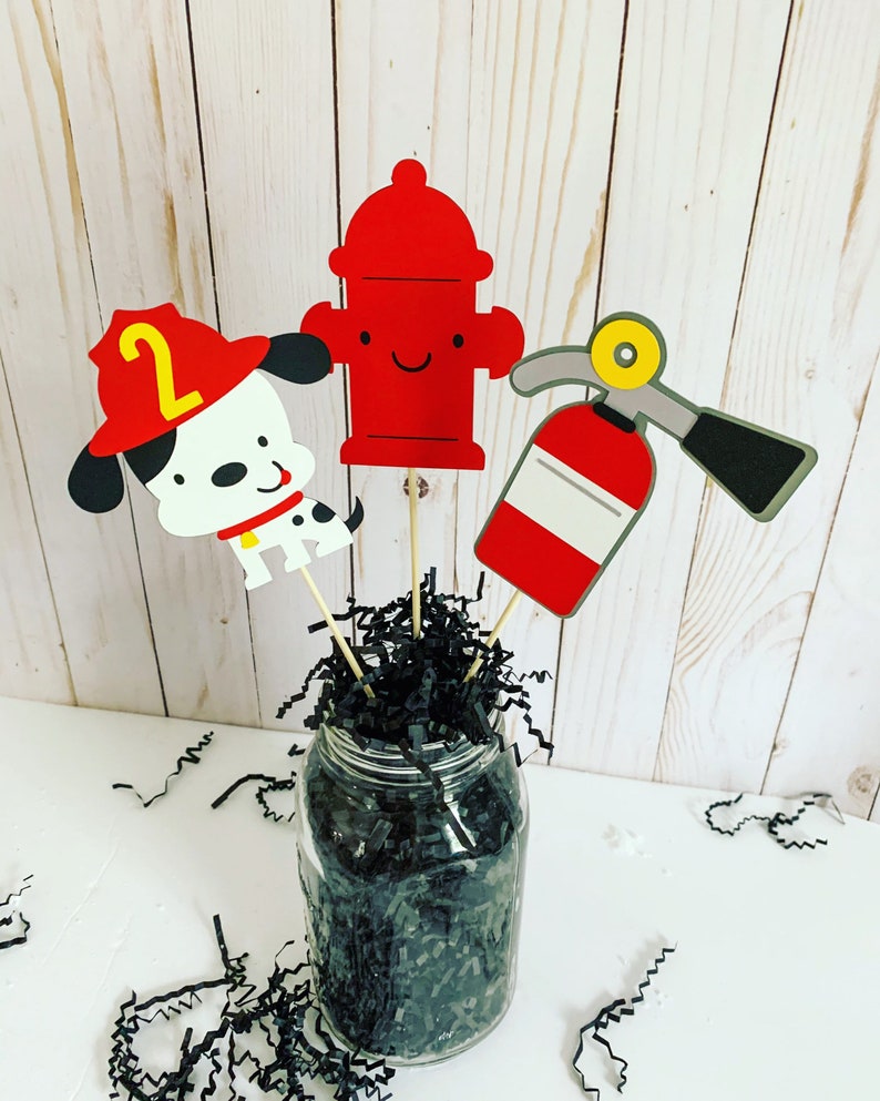 firefighter centerpiece birthday decorations featuring a firetruck, emblem with age, flame, fire hydrant, dalmatian and fire extinguisher
