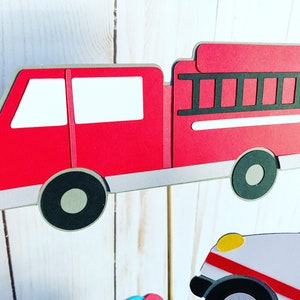 first responders emergency vehicles birthday party or baby shower centerpiece table decorations that include a firetruck, ambulance and police car
