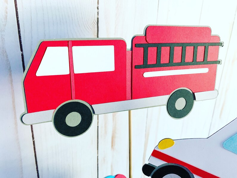 first responders emergency vehicles birthday party or baby shower centerpiece table decorations that include a firetruck, ambulance and police car