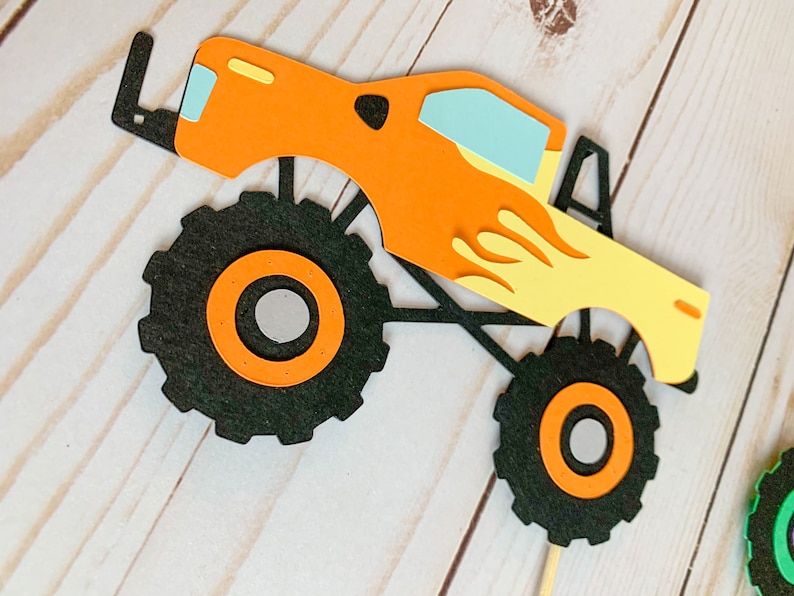 monster jam inspired truck cutouts that include grave digger, megladon, el toro loco, tornado and dragon