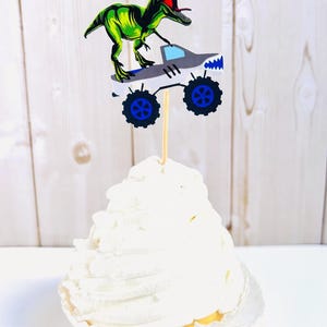 monster truck and t-rex cupcake toppers featuring dragon, megalodon, el toro loco, tornado and grave digger