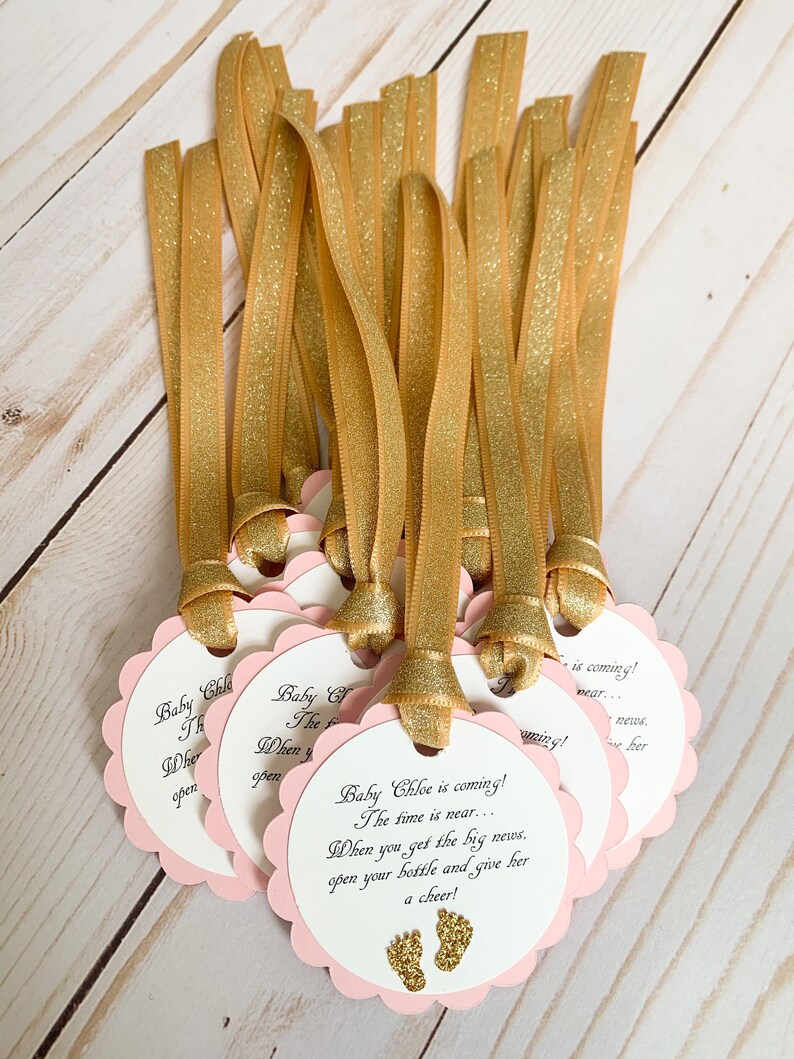 pink and gold baby shower favor tags for mini champagne bottles