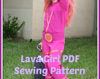 May include: A child in a pink Lava Girl costume with matching pink hair. The costume includes a jumpsuit, belt, and orange accents. Text on the image reads "Lava Girl PDF Sewing Pattern and Tutorial".