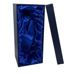 May include: A dark blue rectangular gift box with an open lid. The interior is lined with bright blue satin fabric. The lid is open, showing the satin lining. The box is empty.