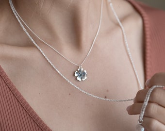 Spring necklace with small silver flower