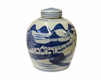 May include: A white ceramic jar with a blue and white painted design of a Chinese landscape. The jar has a lid and is decorated with a traditional Chinese pattern.