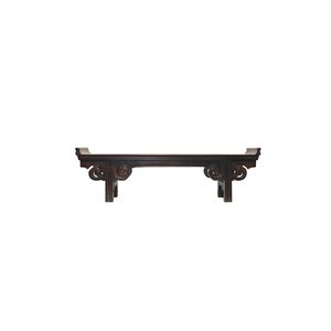 May include: A dark brown wooden bench with intricate carvings on the ends. The bench has a rectangular top and four legs.