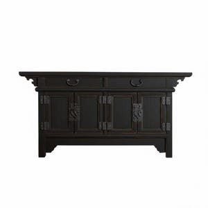 May include: Black wooden cabinet with four doors and two drawers. The cabinet has ornate metal hardware and a decorative top. The doors have rectangular panels and the drawers have curved handles. The cabinet is a dark color.