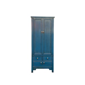 May include: A tall blue wooden cabinet with two doors and three drawers. The cabinet has a traditional design with ornate details and brass hardware.