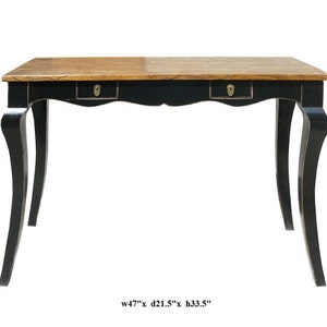 May include: A black wooden table with two drawers and curved legs. The table top is made of wood with a natural finish. The table measures 47 inches wide, 21.5 inches deep, and 33.5 inches high.