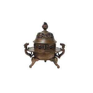 May include: A bronze incense burner with a decorative lid and intricate carvings. The burner features dragon-shaped handles and elephant-shaped feet. The lid is topped with a detailed finial.