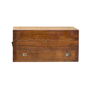 May include: A wooden box with a hinged lid and a drawer. The box is made of dark wood with a smooth finish. The drawer has two brass handles.