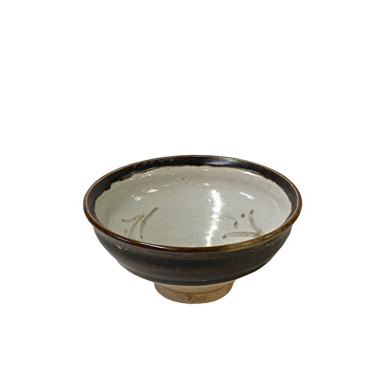 a black-brown-beige-graphic-ceramic-bowl-art
