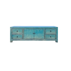 May include: A teal blue wooden media console with two doors and three drawers. The console has black metal hardware.