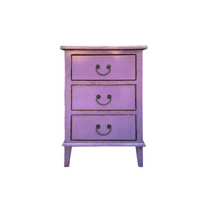 May include: A three-drawer dresser with a purple finish and black metal handles. The dresser has a simple design with straight lines and a slightly distressed look.