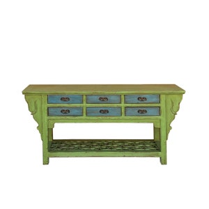 May include: A green wooden console table with six drawers and a lower shelf. The drawers have blue painted fronts and antique brass knobs. The table has a distressed finish.