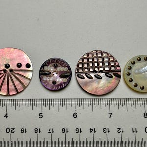 May include: A set of three ceramic mugs with a speckled, matte finish. The mugs are in shades of cream, light gray, and dark gray. Each mug has a simple, minimalist design, perfect for coffee or tea.