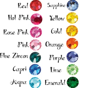 May include: A Sparkle Nation Design rhinestone color chart featuring two columns of circular rhinestones in various colors. Each stone is labeled with its corresponding name, including Red, Sapphire, Hot Pink, Yellow, Rose Pink, Gold, Pink, Orange, Blue Zircon, Purple, Capri, Lime, Aqua, Emerald, Crystal, and Crystal AB.