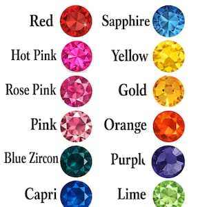 a collection of thirteen different rhinestone colors, each represented by a unique gemstone. The colors include Red, Sapphire, Hot Pink, Yellow, Gold, Pink, Orange, Blue Zircon, Purple, Capri, Lime, Aqua, and Emerald.
