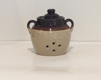 Classic vintage garlic holder in dark brown and tan glaze with lid