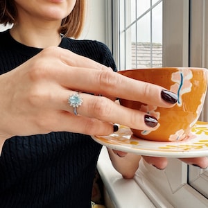 Vintage Aquamarine and Diamond Cluster Ring set in 18ct White Gold.