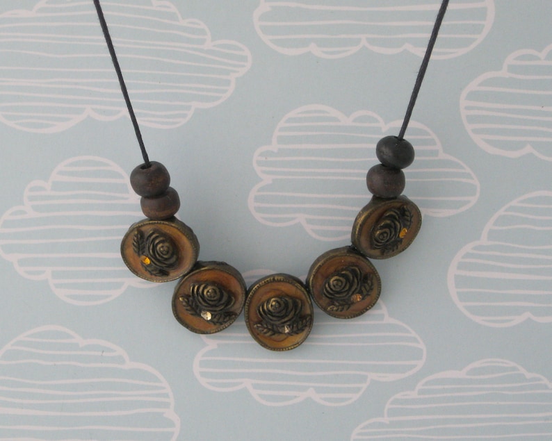 cameo floral pendant necklace simple beaded jewellery made with reclaimed materials statement necklace