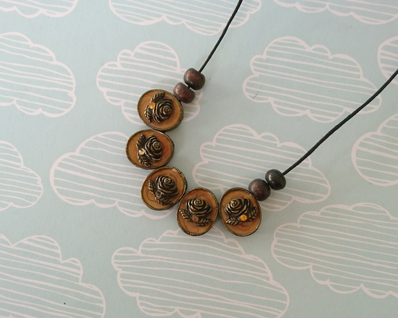 cameo floral pendant necklace simple beaded jewellery made with reclaimed materials statement necklace