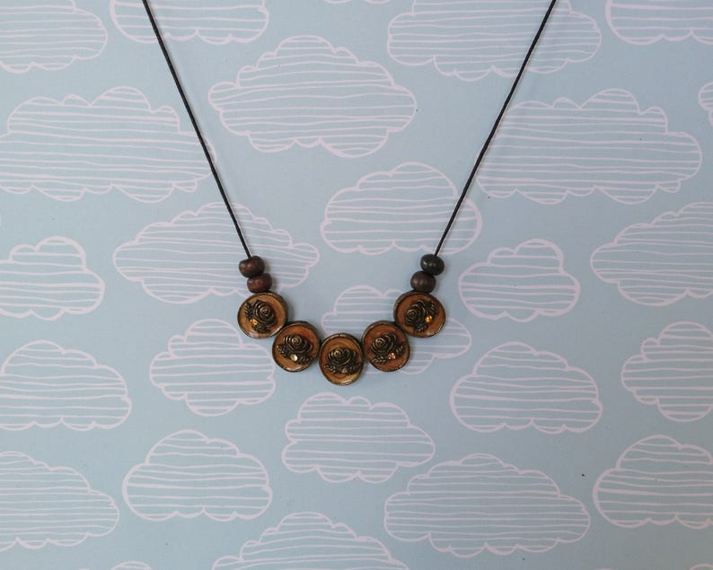 cameo floral pendant necklace simple beaded jewellery made with reclaimed materials statement necklace