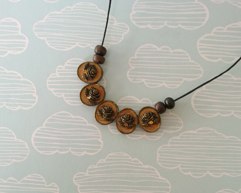 cameo floral pendant necklace simple beaded jewellery made with reclaimed materials statement necklace