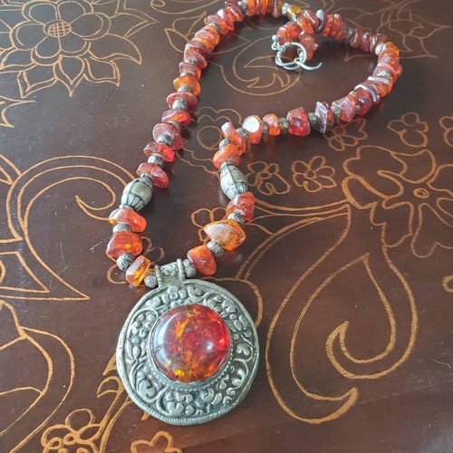 Reduced 15% - Handcrafted designer necklace with vintage Amber and unique Tibetan silver shops pendant - 23 inches long