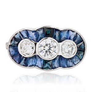 Art Deco Spirit Calibrated Sapphire Diamonds 18 Karat White Gold Ring