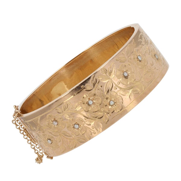 Bracelet jonc or rose ancien à décor floral et ses perles fines
