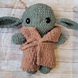 Crochet amigurumi green alien baby