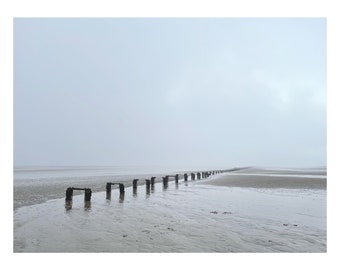 Misty beach in north wales showing a mysterious perspective and landscape. Minimal scene photograph scenic image artwork print wall art gift