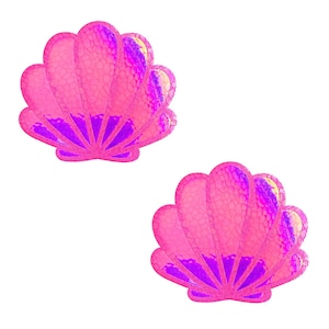 May include: Two pink seashell-shaped embellishments with a textured surface and iridescent highlights. The shells have a fan-like structure with a deep purple base and a bright pink exterior, set against a white background.