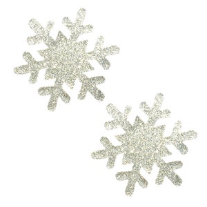 May include: Two silver glitter snowflakes on a white background.