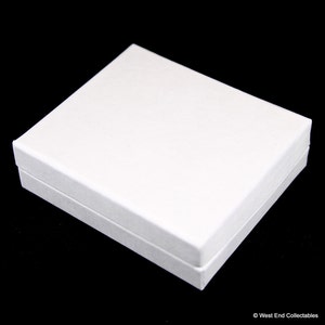 May include: A white rectangular box with a textured surface.
