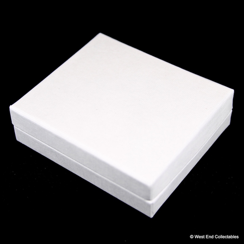 May include: A white rectangular box with a textured surface.