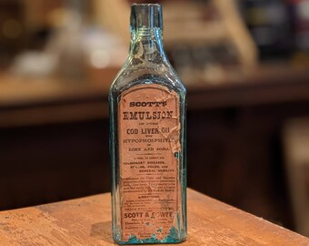 Antica bottiglia di olio di fegato di merluzzo Scott's Emulsion, vetro blu uovo di pettirosso, decorazione medica