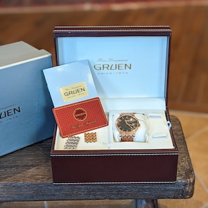 Gruen Swiss Made Herrenuhr mit schwarzem Zifferblatt und Gold Link Stainless Band - Original Box und neuer Batterie