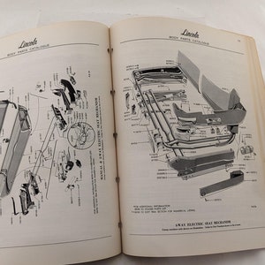 May include: A black and white exploded diagram of a car's rear window and seat mechanism. The diagram shows the parts and their corresponding numbers. The text "AWAY ELECTRIC SEAT MECHANISM" is visible at the bottom of the page.