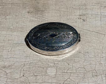 Compacto ovalado vintage de plata de ley