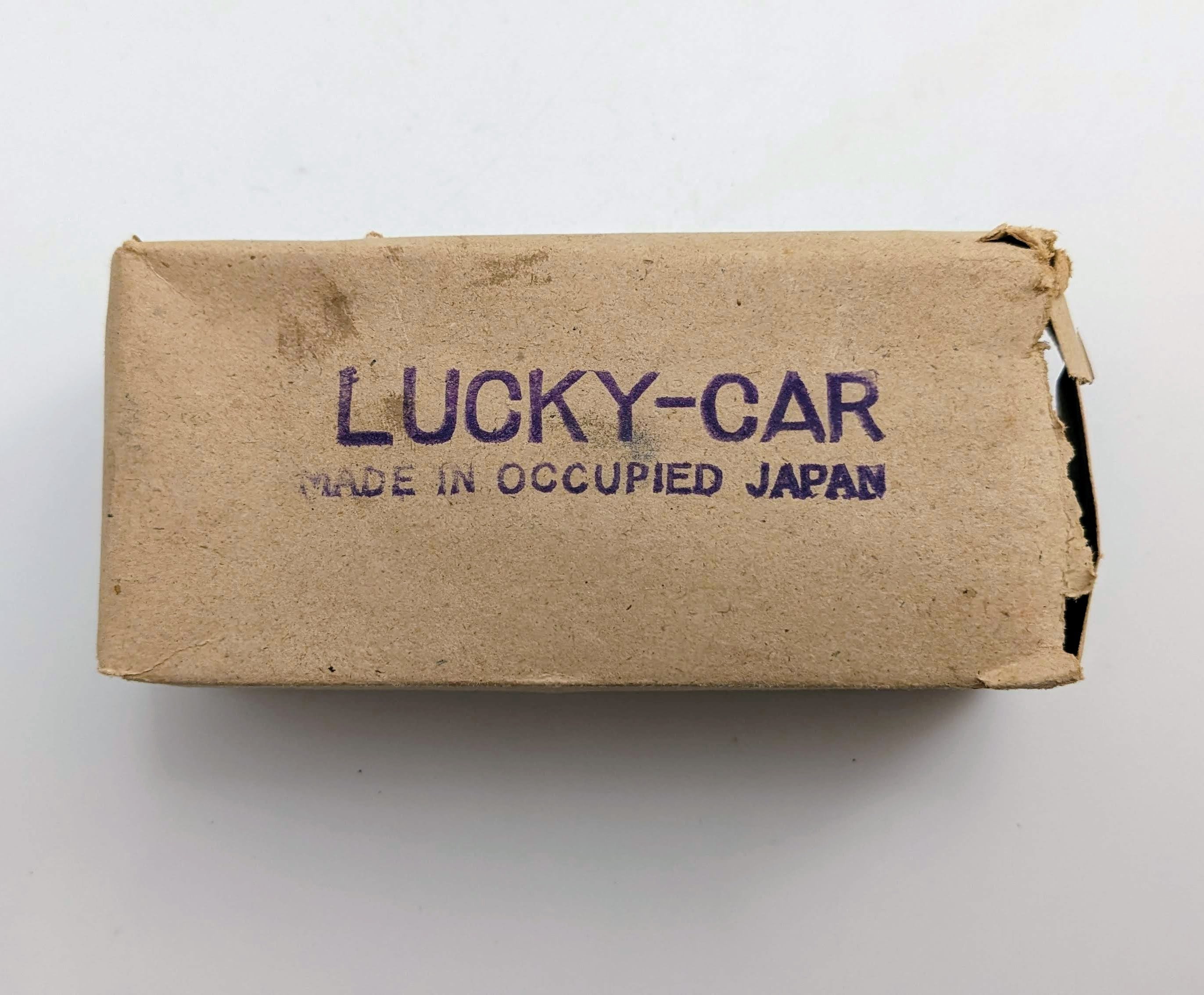 Vintage Lucky Oar Occupied Japan Wind up Metal Toy Car With