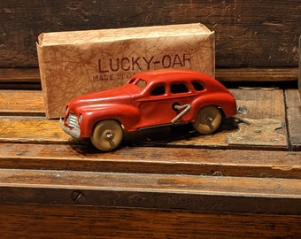 Vintage Lucky Oar Occupied Japan Wind up Metal Toy Car With