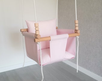 Pink Swing For Toddler With Playing Wooden Beads. Garden Baby Swing With Soft Pillows.