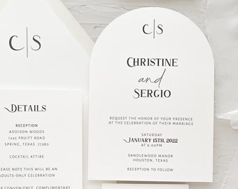 May include: A wedding invitation suite with a white background and black text. The invitation features a simple arch design with the couple's initials "CS" at the top. The invitation text includes the couple's names, the date and time of the wedding, and the location. The RSVP card features a simple design with the couple's initials "M" at the top. The RSVP card text includes the deadline for RSVPs and the options for accepting or declining the invitation.