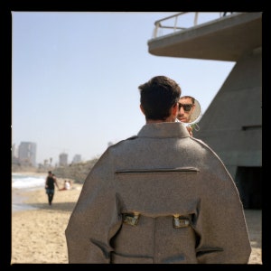 Be Aware Of The Big Brother, Tel Aviv, Israel, Color Analogue Photography Prints 24 x 24 inches, Sunny Seashore, Male Brutalist Fashion