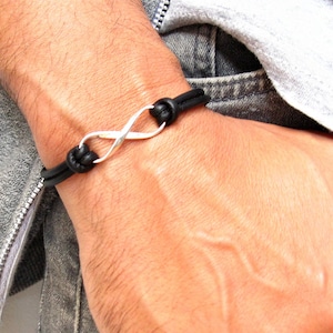 Infinity-armband i svart läder i 925 sterlingsilver